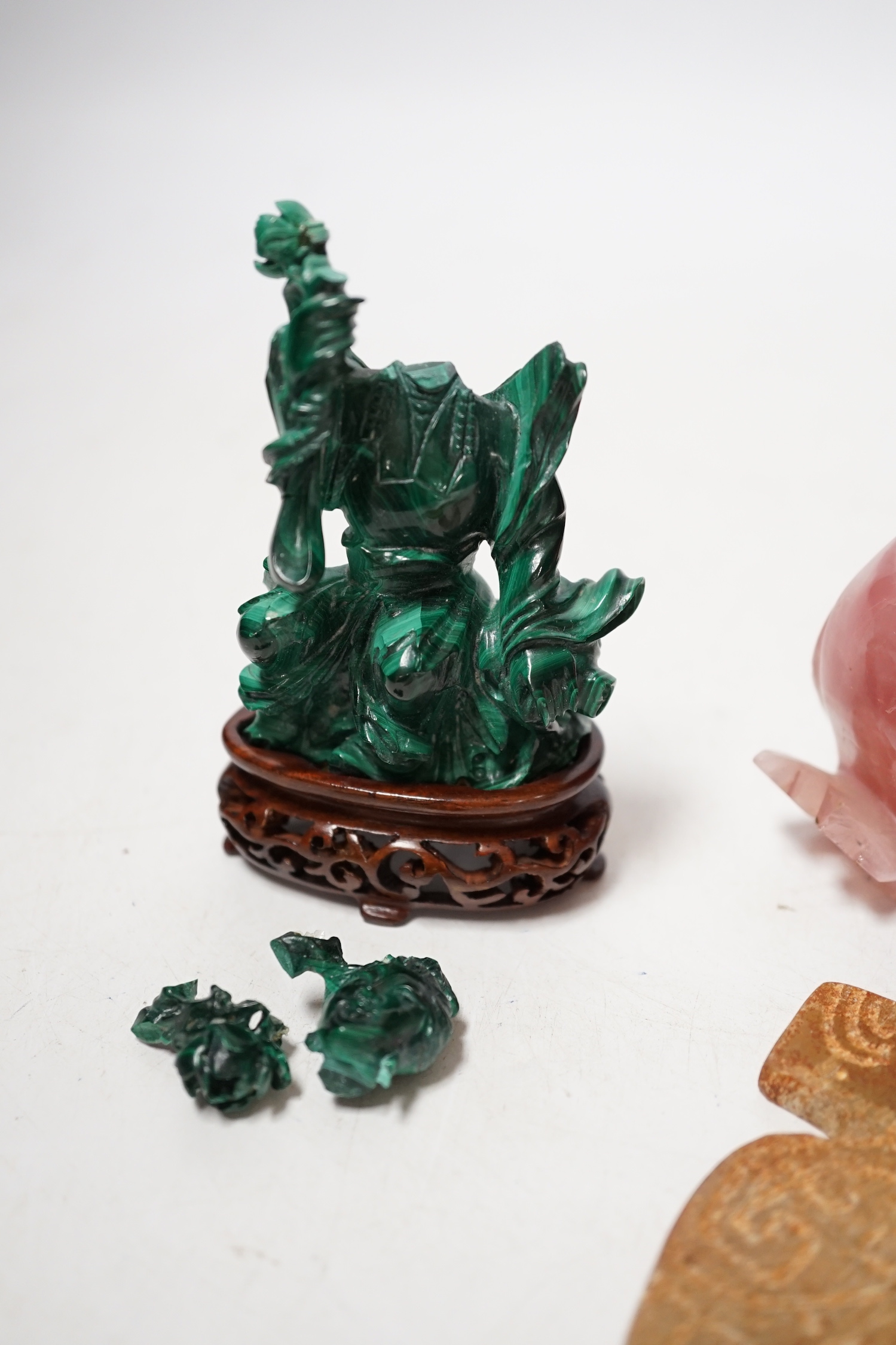 A group of Chinese hardstone carvings and a soapstone cong, largest 10.5cm